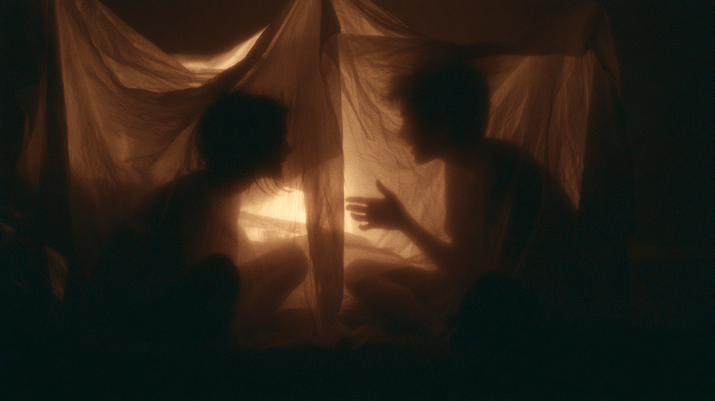 two silhouettes inside glowing tent